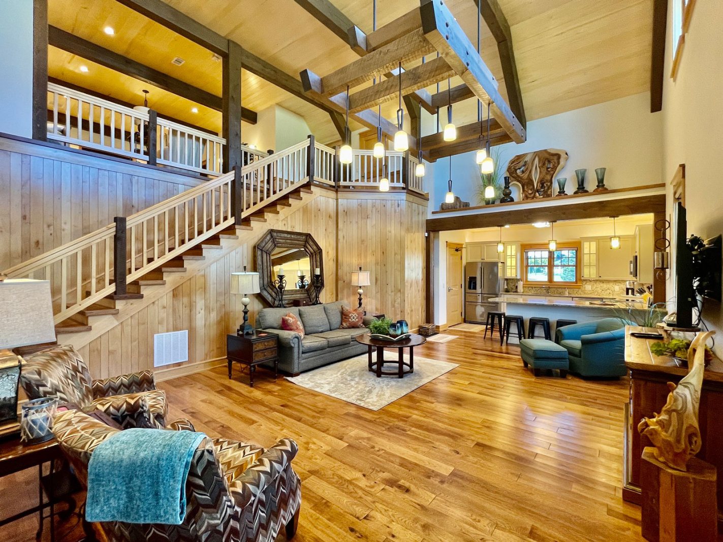 lakeside lodge living room with stairs to second floor