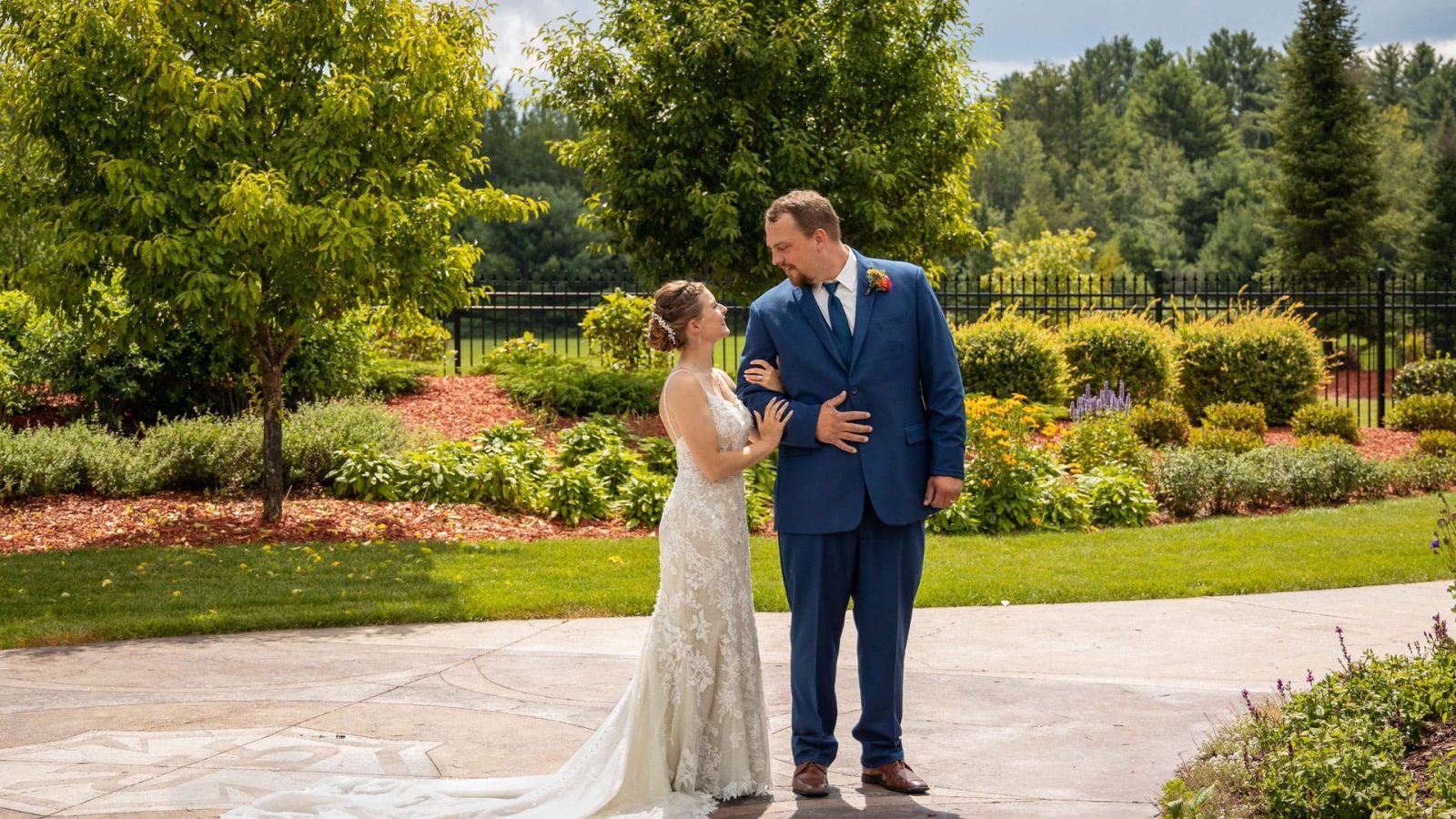 bride and groom on garden path