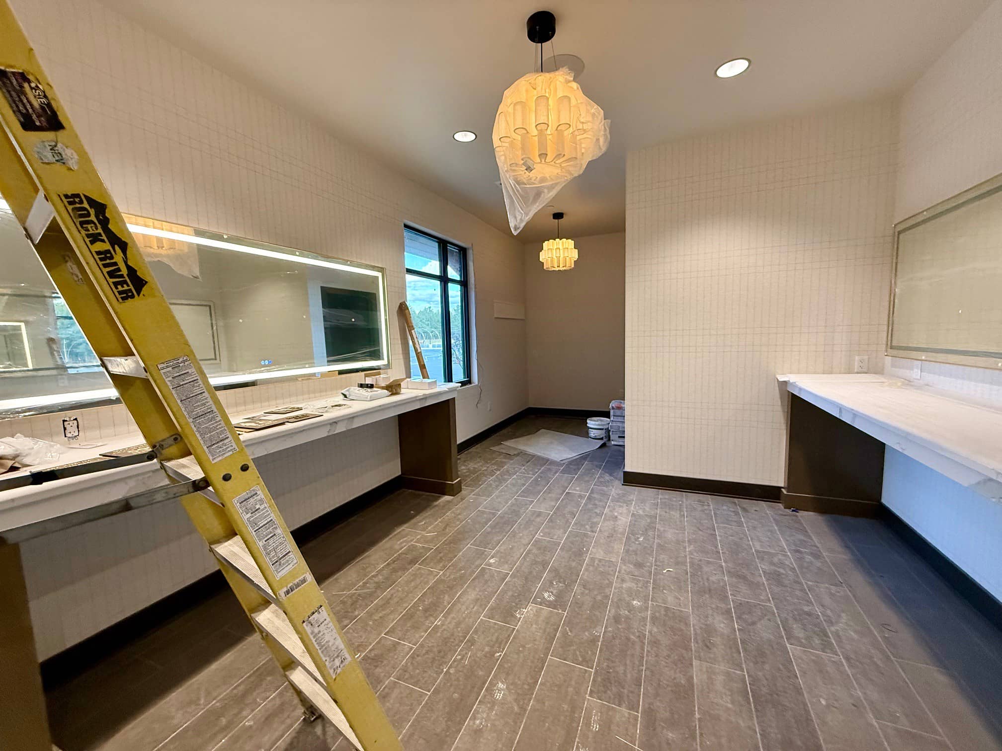 Bridal lounge with expansive mirrors for pre-event prep